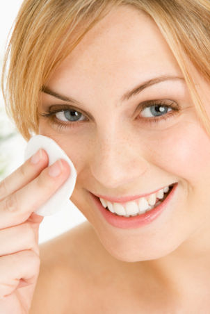 Woman Removing Make Up With Pad