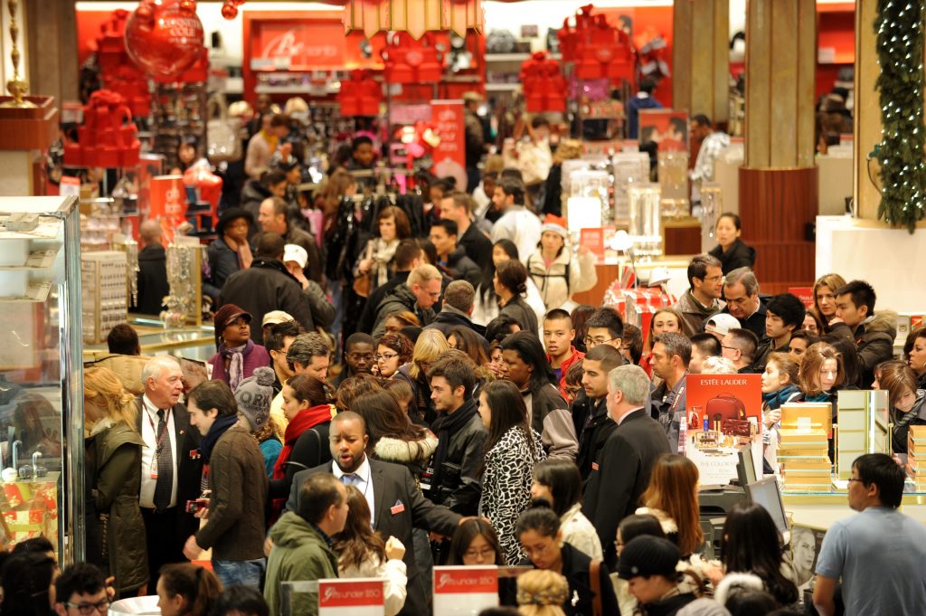 People crowd the aisles inside Macy's de