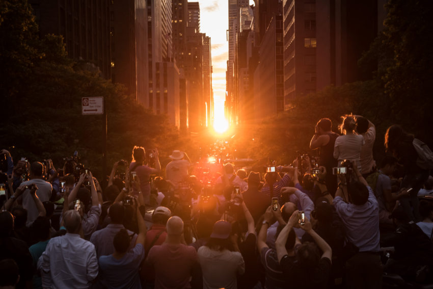 Crowds gather on the Tudor City Overpass to witness Manhattanhenge on Monday, July 12, 2016. The local solar event occurs when the setting sun perfectly aligns with the east-west Manhattan street grid. Michael Appleton/Mayoral Photography Office